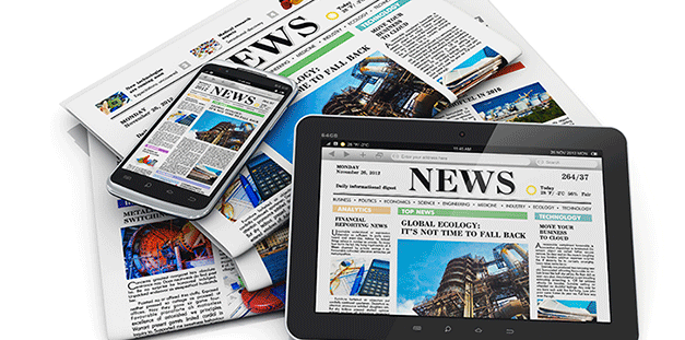 A pile of newspapers, mobile phones, and tablets